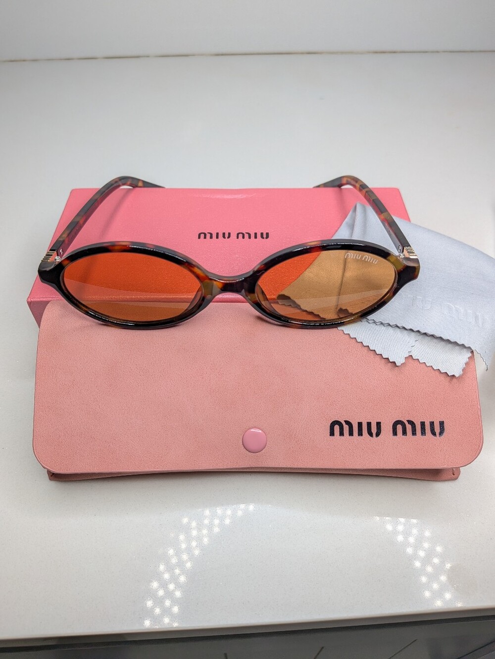Miu Miu Tortoiseshell Oval Sunglasses in Brown - Picture 11 of 11